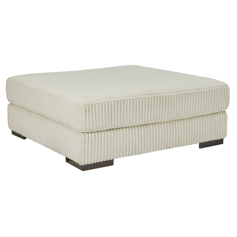 Manufacturer Color_Ivory -- Signature Design by Ashley Lindyn Fabric Ottoman IMAGE 1